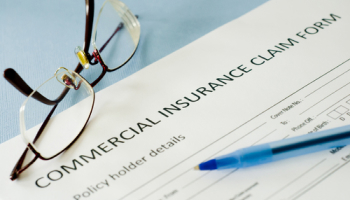 Commercial-insurance-claim-form-with-glasses-and-pen.jpg