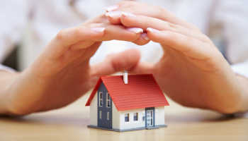 Hands-protecting-a-small-house-model.jpg