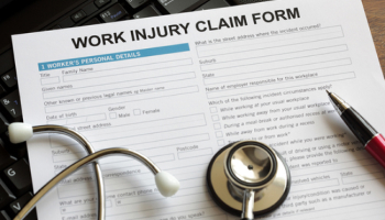 Work-injury-claim-form-with-a-stethoscope.jpg